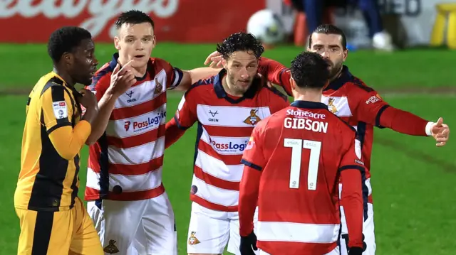 Doncaster players celebrate the only goal of the night in the 1-0 win over Port Vale