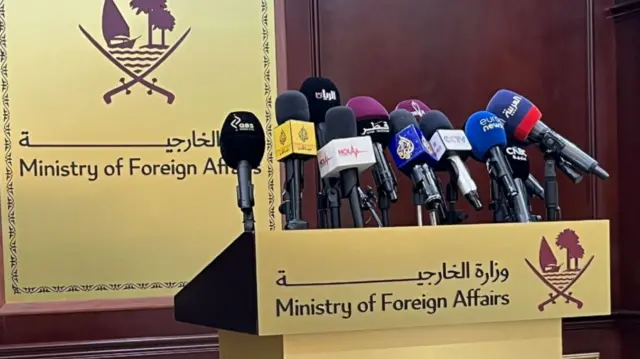 A podium with many mics