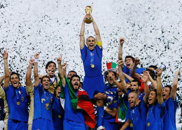 Fabio Cannavaro of Italy lifts the World Cup trophy aloft