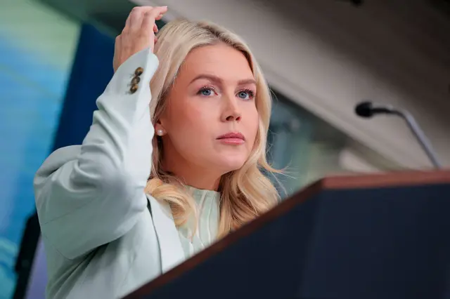 White House Press Secretary Karoline Leavitt scratches her head