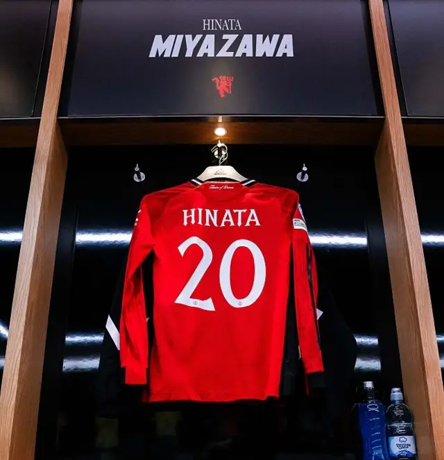 Miyazawa shirt hangs in the dressing room