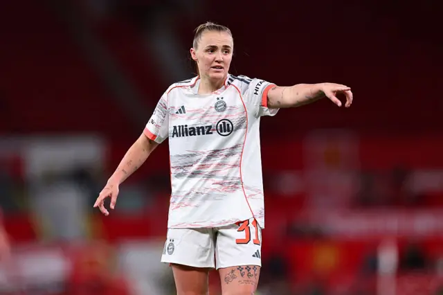 Stanway points directions to team-mates