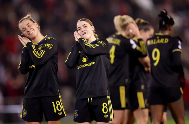 Julia Zigiotti Olme of Manchester United (L) celebrates scoring her team's first goal with teammate Jess Park