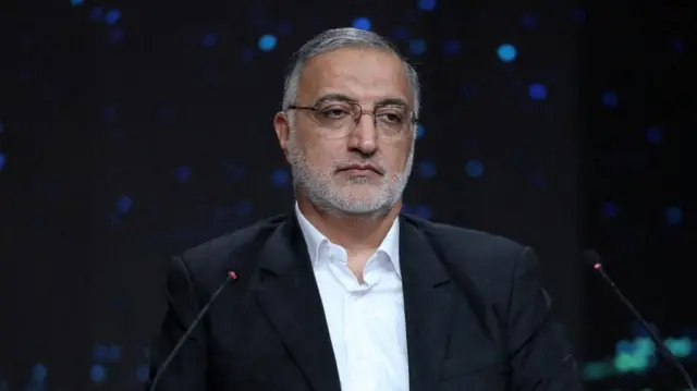 Zakani sat at a television studio in Tehran