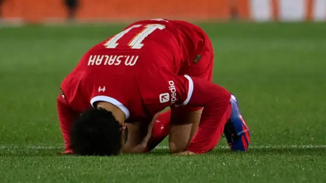 Mohamed Salah kisses turf