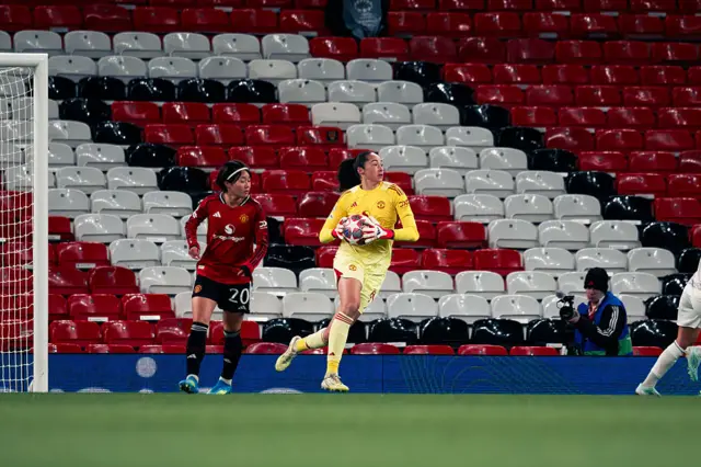 Tullis-Joyce runs forward with the ball in her arms