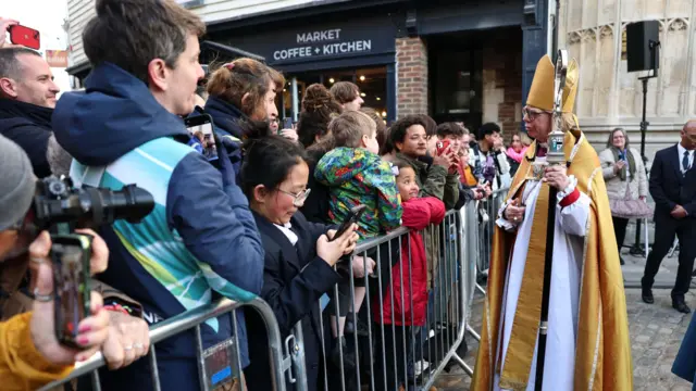 Rows of children speak to Sarah Mullally