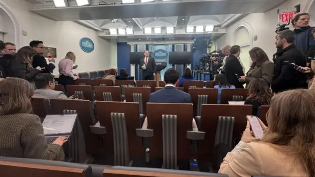 The media preparing for a press briefing in the White House briefing room