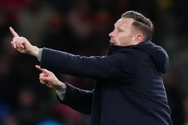 Bellamy signals tactical instructions with his hands