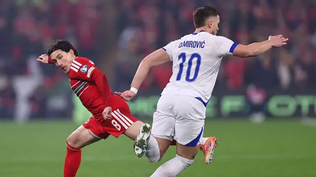 Harry Wilson of Wales and Ermedin Demirovic of Bosnia and Herzegovina