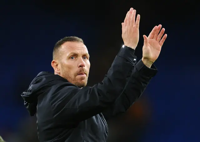 Wales' Head Coach Craig Bellamy applauds the fans
