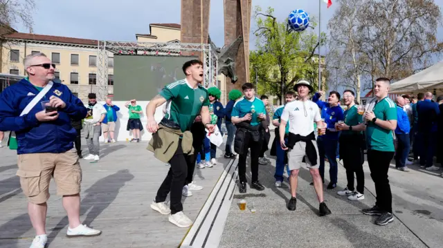 fans playing football