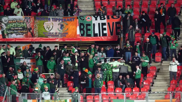 Ireland fans stand in the away end