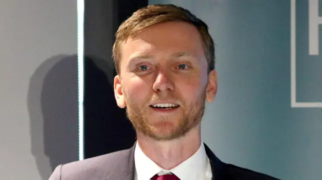 Torsten Bell speaking at a press conference