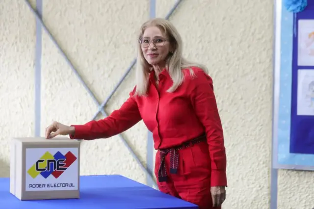 Cilia Flores (wearing all red) voting in the elections for governors and deputies of the National Assembly in Caracas, Venezuela