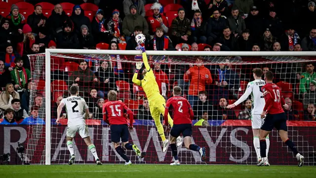 Kelleher reaches to tip the ball over