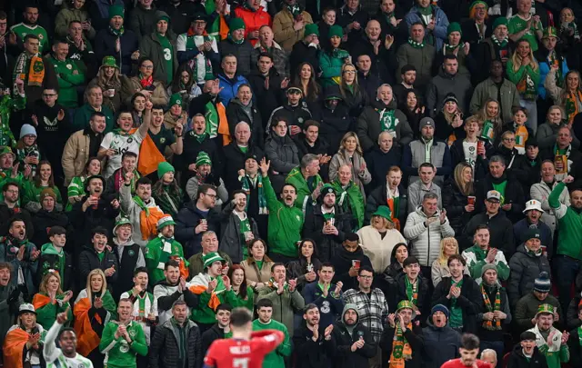 Fans cheer in the away end