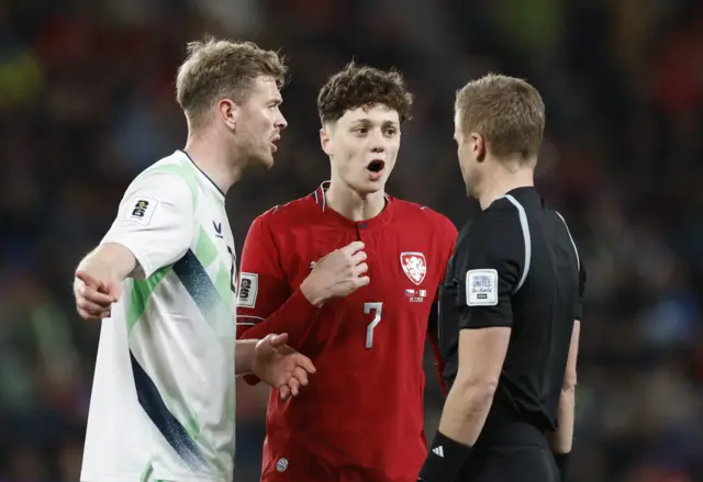 Captains Collins and Krejci argue with the referee