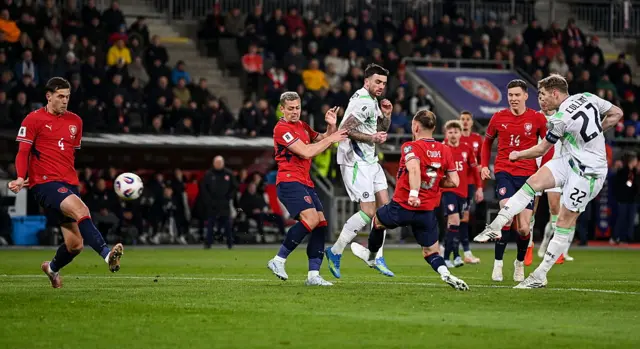 Collins fires a shot against the woodwork