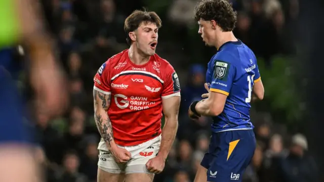 Joe Roberts of Scarlets celebrates after scoring his side's first try