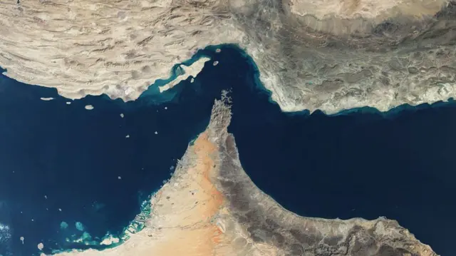 A satellite view of the Strait of Hormuz, a strategic waterway between Iran and Oman that links the Persian Gulf to the Arabian Sea.