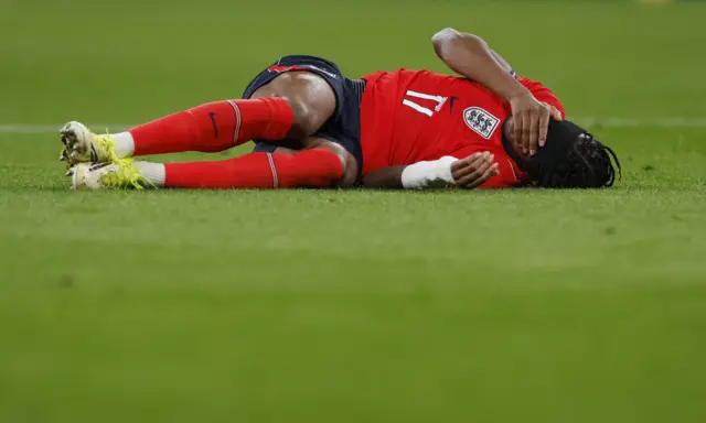 Madueke lies on the floor