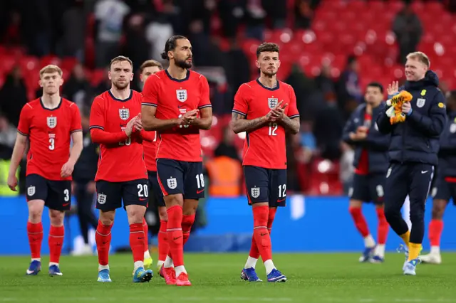 England players clap the fans at the end