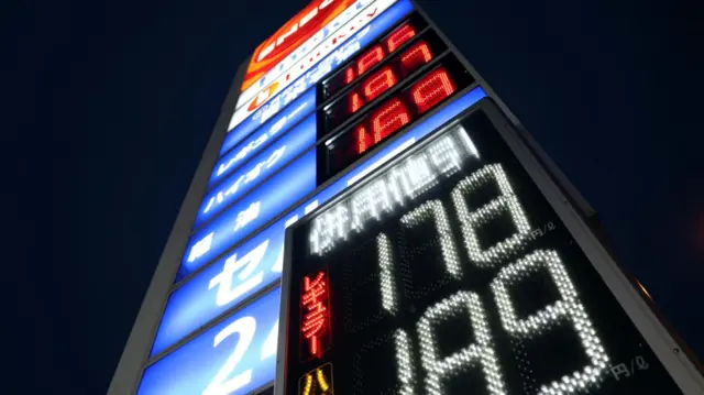 A signboard displays fuel prices outside a gas station, amid the U.S.-Israel conflict with Iran.