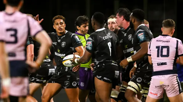 Sharks players celebrate a try