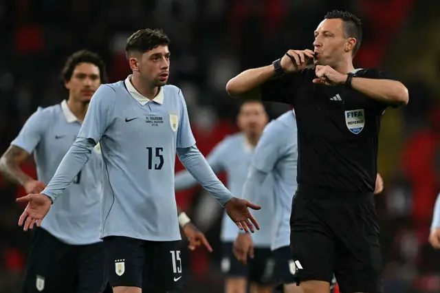 Referee indicates a VAR check