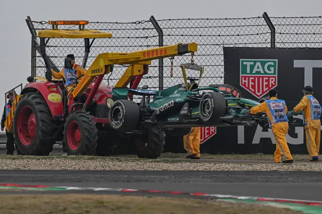 Lance Stroll's car is recovered on the Shanghai circuit