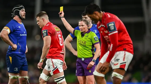 Referee Aimee Barrett-Theron shows Jarrod Taylor of Scarlets a yellow card