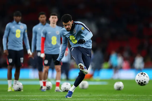 Solanke shoots during the warm up