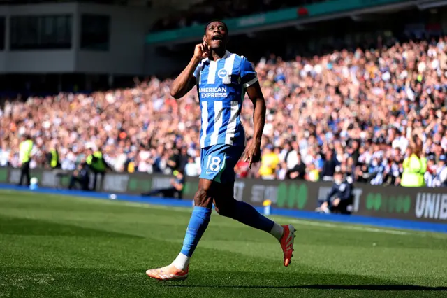 Danny Welbeck cups his ear to the crowd after scoring against Liverpool