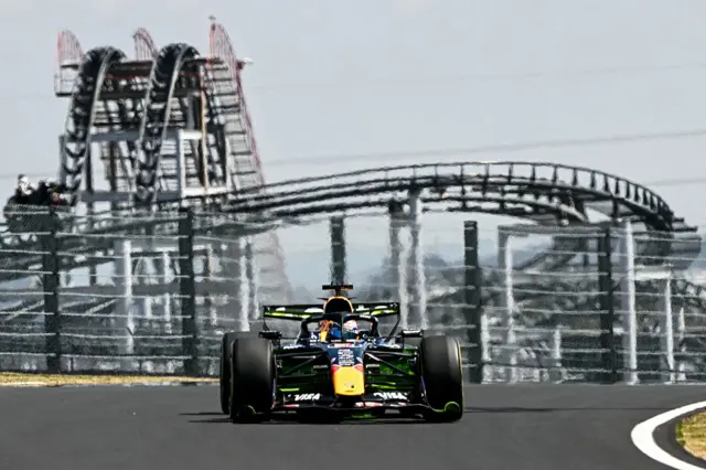 Red Bull's Max Verstappen during Japanese Grand Prix first practice, with a rollercoaster in the background