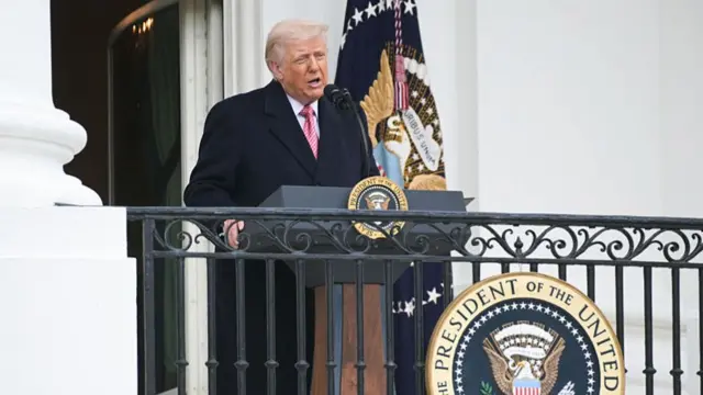 US President Donald Trump delivers remarks to farmers from the Truman balcony of the White House in Washington, DC.