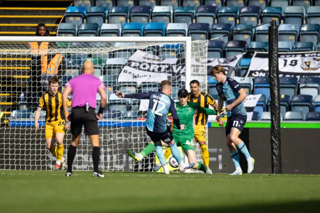 Cauley Woodrow gives Wycombe the lead against Port Vale