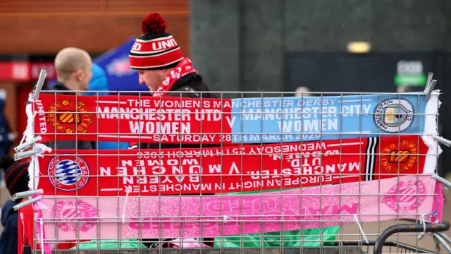 Half and half scarves on a stall outside old Trafford