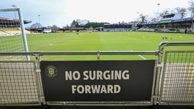Harrogate's Exercise Stadium with a 'no surging forward' sign ahead of kick-off
