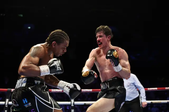 A bloody Nathan Heaney in the ring with Gerome Warburton