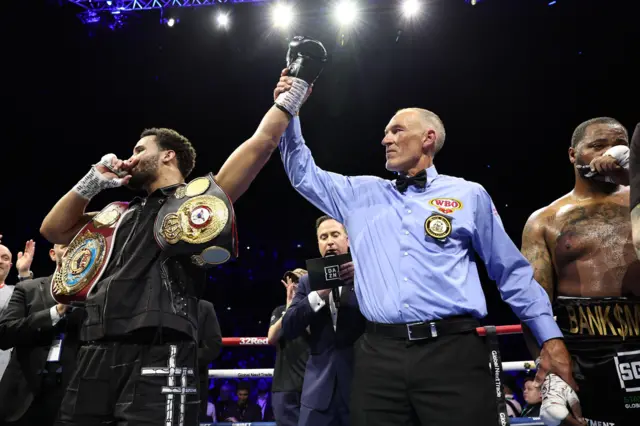 Moses Itauma has his hand raised