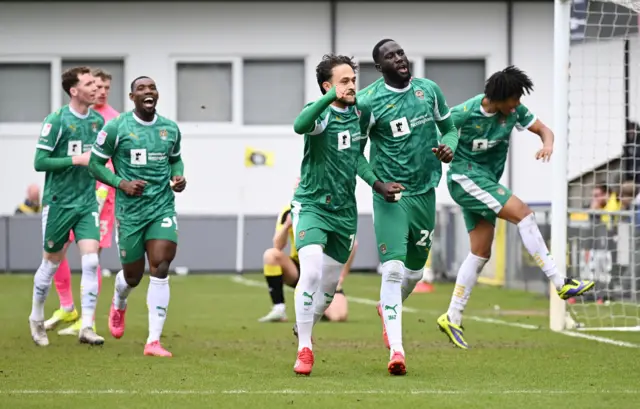 Notts County players celebrate Alassana Jatta's second goal at Harrogate