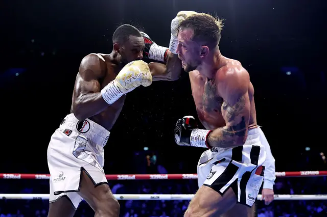 Shakiel Thompson is punched by Brad Pauls