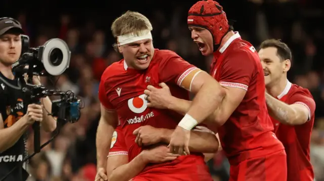 Aaron Wainwright celebrates Wales' first try against Italy