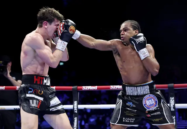 Gerome Warburton lands a punch on Nathan Heaney