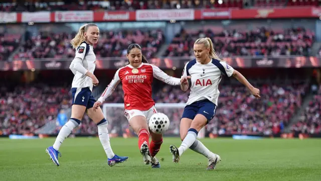 Olivia Smith and Matilda Vinberg battle for possession