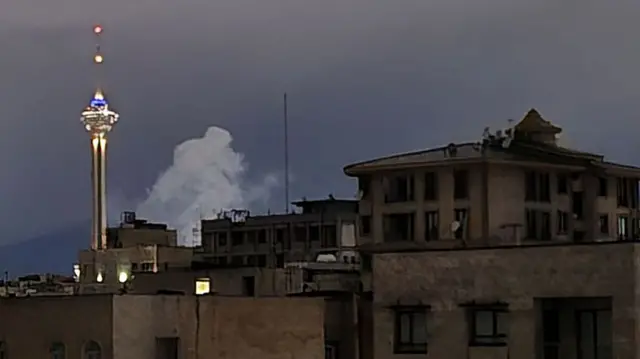A view shows smoke rising following consecutive explosions in the northeastern part of Tehran, Iran.