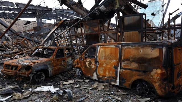 Wreckage of vehicles at an auto service centre in Tehran, Iran, 28 March 2026