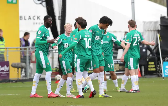 Notts County players celebrate Alassana Jatta's opening goal at Harrogate