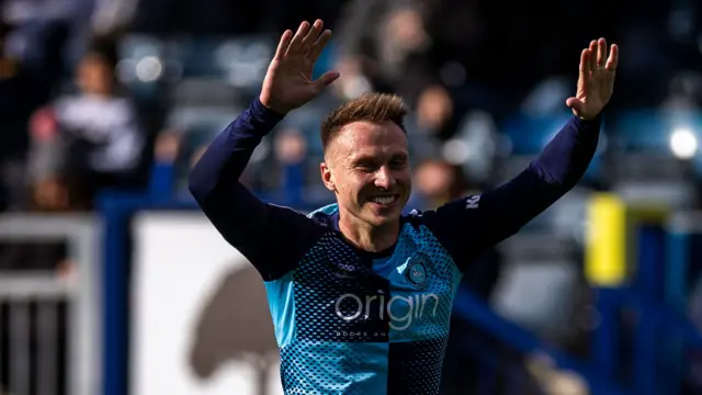 Cauley Woodrow celebrates scoring for Wycombe against Port Vale